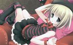  bangs bare_shoulders belt black_skirt blonde_hair copyright_request couch dutch_angle eyebrows_visible_through_hair hat highres indoors looking_at_viewer mole morinaga_korune pillow short_hair skirt sleeveless solo striped thighhighs wallpaper 