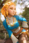  1girl 3d artist_name blonde_hair blue_dress blurry blurry_background braid breasts brown_pants commentary depth_of_field dress english_commentary green_eyes hair_ornament hairclip highres lollipop_in_mouth looking_to_the_side medium_breasts pants patreon_username pointy_ears princess_zelda short_hair solo sreliata the_legend_of_zelda the_legend_of_zelda:_tears_of_the_kingdom triforce 