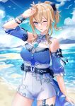  1girl belt blonde_hair blue_eyes blue_shirt blue_sky blue_sleeves bow breasts commentary_request cross cross_earrings detached_sleeves earrings genshin_impact hair_between_eyes hair_bow high-waist_shorts highres jean_(genshin_impact) jean_(sea_breeze_dandelion)_(genshin_impact) jewelry large_breasts long_hair looking_at_viewer mon-chan o-ring o-ring_belt ocean official_alternate_costume one_eye_closed outdoors ponytail shirt shorts sky sleeveless sleeveless_shirt solo white_shorts 
