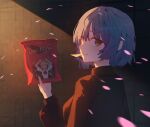 1girl backlighting bag bag_of_chips black_shirt blue_hair bocchi_the_rock! brand_name_imitation character_print chips_(food) commentary_request doritos eyelashes food food_in_mouth froha11037 from_behind hand_up highres holding holding_bag ijichi_nijika long_sleeves looking_at_viewer looking_back mole mole_under_eye shirt short_hair solo turning_head upper_body yamada_ryo yellow_eyes 