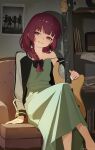  1girl armchair bass_guitar black_bow black_nails blush bocchi_the_rock! bow braid chair commentary_request dot_nose dress earrings green_dress highres hiroi_kikuri hjxbd holding holding_bass_guitar holding_instrument instrument jacket jewelry long_dress looking_to_the_side poster_(object) purple_eyes red_hair sharp_teeth single_braid single_off_shoulder sitting solo spaghetti_strap speaker teeth 