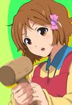  apron bad_id bad_pixiv_id blurry brown_eyes brown_hair candy_wrapper depth_of_field food_themed_hair_ornament hair_ornament highres kanau makino_kanna mallet short_hair solo tamako_market 