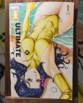  1girl beach breasts bridal_gauntlets closed_mouth commentary commission cover_sketch english_commentary gold_bridal_gauntlets gold_leotard highleg highleg_leotard highres leotard looking_at_viewer marker_(medium) marvel okita on_bed photo_(medium) psylocke purple_eyes purple_hair signature solo traditional_media upside-down x-men 