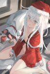  1girl alternate_costume barefoot blue_eyes blush bottle box breasts christmas commentary condom_box convenient_hair dress english_commentary fur_trim gift gift_box hair_between_eyes hat hibiki_(kancolle) highres holding holding_bottle kantai_collection long_hair looking_at_viewer no_panties open_clothes open_dress parted_lips red_dress sack sailor_collar sailor_dress santa_costume santa_hat scroll sitting sleeves_past_wrists small_breasts solo tomushi white_hair 