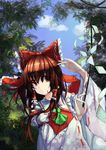  absurdres armband ascot blue_sky bow brown_eyes brown_hair bush cloud dappled_sunlight day detached_sleeves forest frilled_bow frilled_shirt_collar frills gohei hair_bow hair_tubes hakurei_reimu hand_up highres hoshino_arika long_hair looking_to_the_side nature ribbon-trimmed_sleeves ribbon_trim sky smile solo sunlight touhou tree tree_shade upper_body 