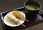  dango food green_tea hokkaido_(artist) kinako_(food) mitarashi_dango no_humans original photorealistic plate realistic skewer still_life tea tray wagashi 