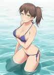  bikini blue_bikini blush breast_hold breasts brown_hair cleavage halter_top halterneck highres kaga_(kantai_collection) kantai_collection large_breasts light_smile long_hair looking_at_viewer navel nigou side-tie_bikini side_ponytail smile solo swimsuit wading water wet yellow_eyes 