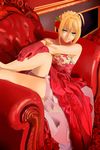  ahoge armchair armpits bare_shoulders blonde_hair chair fate/extra fate_(series) flower gloves green_eyes hair_flower hair_ornament hand_on_leg highres looking_at_viewer nero_claudius_(fate) nero_claudius_(fate)_(all) rose sitting smile solo zenyu 