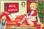  ahoge artoria_pendragon_(all) avalon_(fate/stay_night) blonde_hair candy candy_cane christmas christmas_ornaments christmas_tree curtains elbow_gloves excalibur fate/stay_night fate_(series) food gift gloves green_hair highres merry_christmas saber santa_costume solo striped striped_legwear thighhighs wreath yurix 