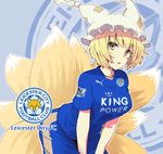  blonde_hair clothes_writing england english fox_tail fujii_jun hat jersey leicester_city_fc looking_at_viewer multiple_tails premier_league puma_ag short_hair soccer soccer_uniform solo sportswear tail touhou trait_connection yakumo_ran yellow_eyes 