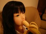  1girl asian banana black_hair doll food fruit insertion open_mouth photo 