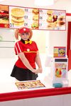  1girl asian bow bowtie brand_name_imitation breasts brown_eyes brown_hair chouzuki_maryou cosplay employee_uniform fast_food fast_food_uniform female food hamburger hataraku_maou-sama! large_breasts photo plump polo_shirt ribbon sasaki_chiho sasaki_chiho_(cosplay) short_hair short_twintails skirt solo twintails uniform visor_cap 