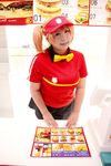  1girl asian bow bowtie brand_name_imitation breasts brown_eyes brown_hair chouzuki_maryou cosplay employee_uniform fast_food fast_food_uniform female food hamburger hataraku_maou-sama! large_breasts photo plump polo_shirt ribbon sasaki_chiho sasaki_chiho_(cosplay) short_hair short_twintails skirt solo twintails uniform visor_cap 