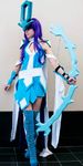  blue_dress boots bow_(weapon) cosplay dress holding holding_weapon looking_to_the_side personification photo pokemon purple_hair solo standing suicune thigh_boots weapon 