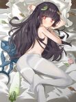  1girl absurdres animal_ears ass bed black_hair blue_archive blush closed_mouth clothing_aside commentary_request condom fake_animal_ears highres hime_cut leaf long_hair looking_at_viewer miyu_(blue_archive) pantyhose pillow playboy_bunny red_eyes ryoma_(rym_369) solo topless 