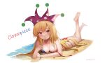  1girl alternate_costume barefoot beach bikini blonde_hair blush breasts character_name cleavage clownpiece commentary_request dobostorte hat highres jester_cap long_hair looking_at_viewer lying no_wings on_stomach polka_dot polka_dot_headwear purple_hat sand solo swimsuit touhou untied_bikini very_long_hair water 