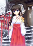  2015 arrow black_hair blue_eyes chinese_zodiac collarbone hakama hamaya highres holding holding_weapon japanese_clothes long_hair miko new_year original outdoors red_hakama smile snow solo weapon year_of_the_goat yurina 