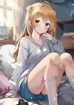  1girl ahoge aizawa_(aizawatsu) alternate_costume bed bedroom blue_shorts blush book breasts brown_hair closed_mouth commentary controller curtains double_bun drawstring feet_out_of_frame flower game_controller girls&#039;_frontline green_eyes grey_hoodie hair_bun highres hood hood_down hoodie indoors kneehighs long_hair long_sleeves looking_at_viewer medium_breasts pillow rfb_(girls&#039;_frontline) shorts sleeves_past_wrists smile socks solo sunlight vase white_socks window 