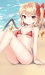  arm_support bad_id bad_twitter_id bangs beach bikini blonde_hair blush bow closed_mouth collarbone day demon_wings fang fang_out flandre_scarlet hair_bow highres looking_at_viewer outdoors papo red_bikini red_bow red_eyes side-tie_bikini side_ponytail sitting smile solo swimsuit touhou water wings 