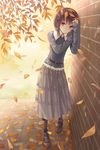  against_wall autumn autumn_leaves bangs belt black_legwear brick_wall brown_eyes brown_hair eyebrows_visible_through_hair falling_leaves frilled_skirt frills full_body grey_skirt highres leaf long_skirt long_sleeves looking_at_viewer mary_janes outdoors photo-referenced shoes skirt sleeves_past_wrists solo standing tokumaru 