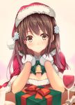  bell blurry blush box brown_eyes brown_hair capelet commentary_request cup depth_of_field drinking_glass flower gift gift_box gintarou_(kurousagi108) gloves hair_flower hair_ornament hat long_hair looking_at_viewer original red_gloves santa_costume santa_hat smile solo wine_glass 