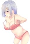  arms_behind_back ashino blush bra breasts hair_ornament hair_over_one_eye hairclip hamakaze_(kantai_collection) kantai_collection looking_to_the_side medium_breasts navel purple_eyes short_hair silver_hair solo strap_slip underwear undressing 