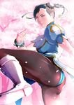  1girl artist_request ass black_hair boots bun_cover capcom cherry_blossoms chinese_clothes chun-li fighting_stance pantyhose petals solo spiked_bracelet street_fighter takemaru08 