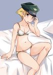  abenattou adjusting_clothes adjusting_hat arm_support bed blonde_hair blue_background blush bra brown_eyes camouflage camouflage_bra camouflage_panties crotch_seam erwin_(girls_und_panzer) girls_und_panzer hat looking_at_viewer panties parted_lips peaked_cap pillow short_hair solo sweatdrop underwear underwear_only white_bra white_panties 