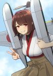  1girl aircraft airplane bangs blush breasts brown_hair brown_hakama eyebrows_visible_through_hair fingernails grin hakama hakama_skirt highres holding hyuuga_(kantai_collection) japanese_clothes kantai_collection koubakotone looking_at_viewer nontraditional_miko propeller red_eyes seaplane shirt short_hair skirt sky smile solo undershirt v zuiun_(kantai_collection) 