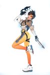  1girl asian bodysuit cosplay gun overwatch photo solo tracer_(overwatch) weapon 