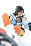  1girl asian bodysuit cosplay gun overwatch photo solo tracer_(overwatch) weapon 