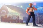  biceps blonde_hair box capcom fighting_stance guile highres manly military military_uniform necktie official_art radio sleeves_rolled_up solo_focus street_fighter street_fighter_v sunglasses tattoo uniform 