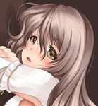  akatsuki_akane from_side kantai_collection light_brown_eyes light_brown_hair long_hair looking_at_viewer lying on_stomach open_mouth pola_(kantai_collection) solo tareme wavy_hair 