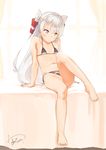  amatsukaze_(kantai_collection) bare_shoulders barefoot bikini blush brown_eyes flat_chest full_body hair_tubes highres kanamura_will kantai_collection leg_up long_hair navel signature silver_hair simple_background sitting solo swimsuit two_side_up windsock 