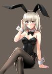  animal_ears arm_support bare_shoulders black_bow black_legwear blue_eyes blush bow bowtie breasts bunny_ears bunnysuit cleavage crossed_legs detached_collar fake_animal_ears girls_und_panzer itsumi_erika katahira_masashi looking_at_viewer medium_breasts pantyhose short_hair silver_hair simple_background sitting solo wrist_cuffs 