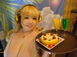  asian blonde_hair breasts brown_eyes cleavage cosplay fat headphones hoshima_mika huge_breasts jewelry necklace nitroplus photo solo star super_pochaco super_pochaco_(cosplay) twintails 