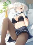  bed bed_sheet belly black_bra black_legwear blue_eyes blush bra breasts dutch_angle eyebrows eyebrows_visible_through_hair eyes_visible_through_hair hair_ornament hair_over_one_eye hairclip hamakaze_(kantai_collection) igakusei kantai_collection large_breasts looking_at_viewer lying midriff mouth_hold navel on_back pantyhose school_uniform serafuku short_sleeves silver_hair solo underwear 