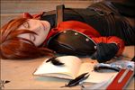  book cosplay crisis_core_final_fantasy_vii eyes_closed feather final_fantasy final_fantasy_vii genesis_rhapsodos jacket male_focus photo red_hair red_jacket solo sword 