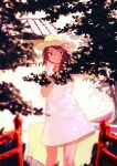  1girl blush braid brown_eyes brown_hair building closed_mouth commentary_request dappled_sunlight dress hand_up hat highres inami_hatoko long_hair looking_at_viewer nature original single_braid sleeveless sleeveless_dress solo sun_hat sundress sunlight white_dress 