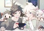  2boys absurdres ahoge alternate_costume bed black_pants brown_eyes brown_hair character_doll collarbone danganronpa_(series) danganronpa_2:_goodbye_despair grey_hair grin handheld_game_console hands_up highres hinata_hajime holding holding_handheld_game_console indoors komaeda_nagito long_sleeves lying male_focus messy_hair midou_(grk12138) multiple_boys nintendo_switch on_bed on_stomach pants parted_lips pillow short_hair smile teeth 