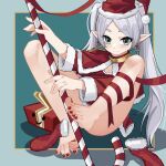  1girl barefoot breasts candy candy_cane capelet christmas christmas_stocking cleavage dress earrings elf feet food frieren fur_trim gift green_eyes grey_hair hat highres holding holding_staff jewelry long_hair looking_at_viewer nanase_young outside_border parted_bangs pointy_ears red_nails santa_capelet santa_dress santa_hat solo sousou_no_frieren staff toes twintails white_hair 