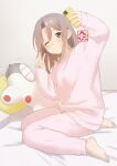  1girl :t alternate_costume arm_up barefoot bed_sheet blush brown_eyes brown_hair cellphone commentary_request feet full_body hair_between_eyes holding holding_phone indoors iphone kantai_collection long_hair long_sleeves on_bed one_eye_closed pajamas pants phone pillow pink_hair pink_pants sakiecho sidelocks sitting sleeves_past_wrists smartphone solo stuffed_airplane stuffed_toy taking_picture v wariza zuikaku_(kancolle) 