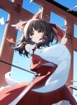  1girl absurdres ascot between_fingers blue_sky bow brown_hair chinese_commentary closed_mouth commentary_request day detached_sleeves frilled_bow frilled_hair_tubes frills gohei hair_bow hair_tubes hakurei_reimu highres holding holding_gohei jiangchuan_ling_yu_nai long_hair looking_at_viewer ofuda ofuda_between_fingers outdoors red_bow red_eyes red_skirt skirt skirt_set sky solo torii touhou yellow_ascot 