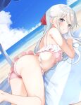  1girl :o absurdres ass beach bikini blush cloud commentary_request day feet_out_of_frame frilled_bikini frills grey_eyes grey_hair hair_ribbon hamaken._(novelize) highres long_hair looking_at_viewer lying ocean on_stomach open_mouth original outdoors pink_bikini red_ribbon ribbon solo swimsuit 