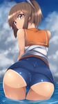 ass blue_sky blurry brown_eyes brown_hair cloud cloudy_sky commentary day depth_of_field from_behind highres i-401_(kantai_collection) kantai_collection leaning_forward looking_at_viewer looking_back mku ocean ponytail school_swimsuit school_uniform serafuku sky smile solo swimsuit swimsuit_under_clothes tan wading wet wet_clothes 