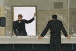  2boys arm_up bathroom black_bow black_hair black_jacket black_pants blonde_hair bow bowtie ccrux00 commentary curly_hair doorway english_commentary formal_clothes heated_rivalry highres ilya_rozanov indoors jacket layered_sleeves long_sleeves male_focus mirror multiple_boys pants parted_bangs reflection shane_hollander shirt short_hair sink suit_jacket suit_pants tile_wall tiles vent_(object) white_shirt wing_collar 