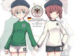  blue_eyes brown_eyes clothes_writing fujii_jun german german_flag germany hand_on_hip hat holding_hands kantai_collection long_sleeves military_hat multiple_girls sailor_hat short_hair shorts silver_hair soccer soccer_uniform sportswear translated west_germany world_cup z1_leberecht_maass_(kantai_collection) z3_max_schultz_(kantai_collection) 