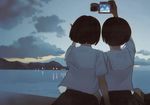  brown_hair camera copyright_request dusk facing_away from_behind highres multiple_girls ocean outdoors school_uniform self_shot short_hair sky smile sunset takamichi taking_picture water 