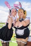  2girls asian blonde_hair breasts brown_eyes cleavage cosplay fat headphones hoshima_mika huge_breasts jewelry multiple_girls necklace nitroplus photo pink_hair star super_pochaco super_pochaco_(cosplay) super_sonico super_sonico_(cosplay) suzumar36 twintails 