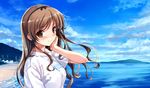  beach blush brown_eyes brown_hair cloud day game_cg highres long_hair misaki_kurehito mole mole_under_eye nakano_hinata ocean outdoors sky solo suiheisen_made_nan_mile? 